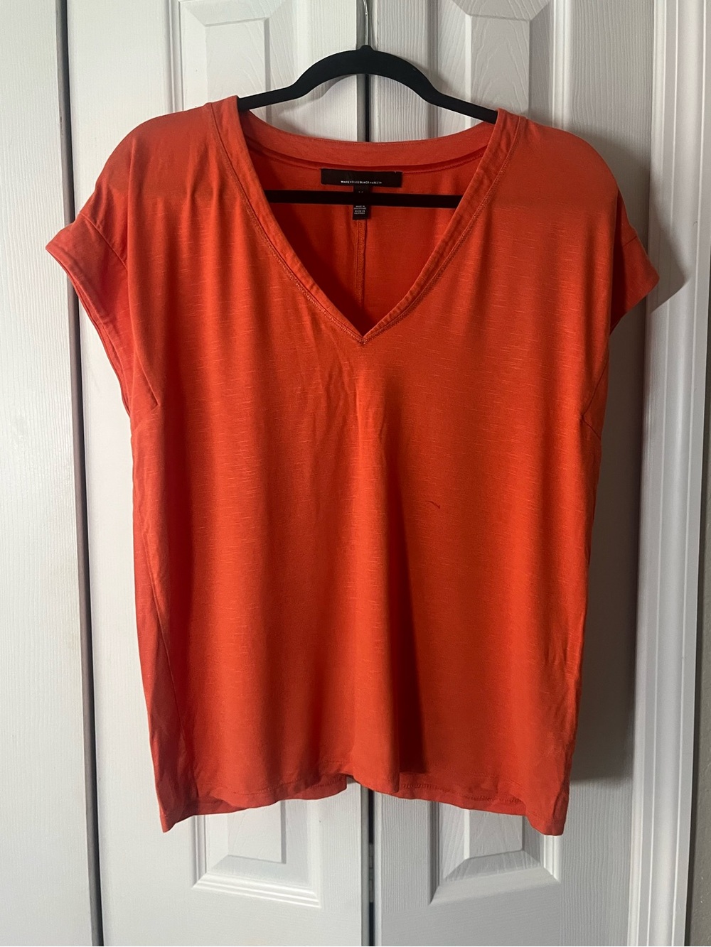 White House Black Market orange v-neck short sleeve shirt size Medium